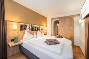 Postel nebo postele na pokoji v ubytování Biohotel Leutascherhof