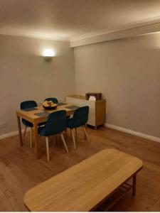 a dining room with a table and chairs in a room at Modern two bed flat in Canada Water close to transport in London