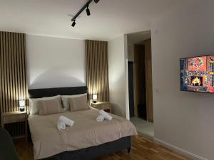 Ein Bett oder Betten in einem Zimmer der Unterkunft Apartman Aleksandar