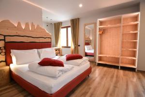 Voodi või voodid majutusasutuse Hotel Cima d'Oro toas