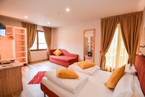 Voodi või voodid majutusasutuse Hotel Cima d'Oro toas