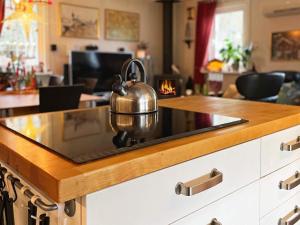 a tea kettle sitting on a stove in a kitchen at Holiday home NÄSSJÖ III in Nässjö