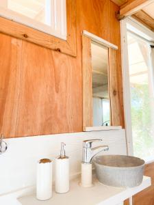 a bathroom with a sink and a mirror at Luna roja in Punta Del Diablo