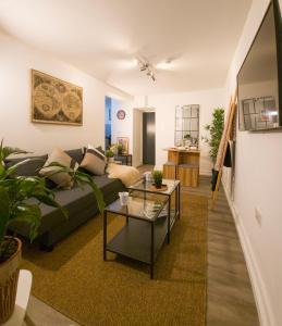 a living room with a couch and a table at Plenty of Parking Available; 3 Bedroom Apartment by Property Promise in Cardiff