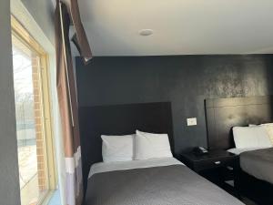 Ένα ή περισσότερα κρεβάτια σε δωμάτιο στο Budget Inn Danville