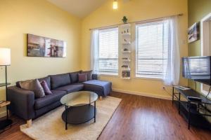 a living room with a couch and a table at The Niven Lake Retreat in Yellowknife