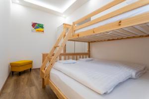 Postel nebo postele na pokoji v ubytování Rezidence Abertamy
