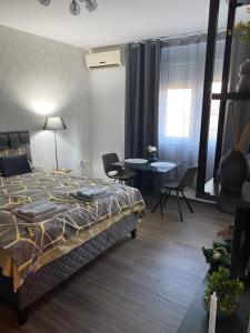 Postel nebo postele na pokoji v ubytování Apartman Felix