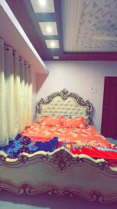 a bedroom with a large bed in a room at Janhavi Villa in Dapoli