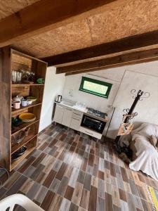 a small room with a kitchen and a floor at Techos amarillos 3 in Castillos +9 photos