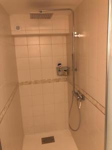 a shower with a glass door in a bathroom at agréable chambre d hôte avec piscine et jacuzzi in Thégra +23 photos