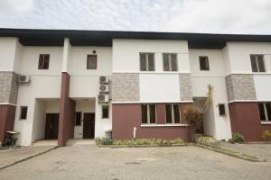 a large white building with a courtyard at Unit i2 City House (Sleeps 6) in Lagos