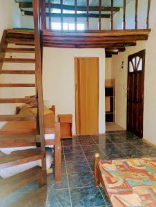 a room with a bunk bed and a stairway at Casa tipo cabaña El Faro (con seña) in Mar del Plata