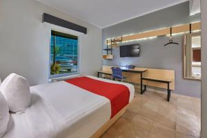 Postel nebo postele na pokoji v ubytování City Express by Marriott Cancun
