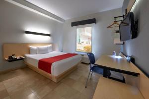 TV a/nebo společenská místnost v ubytování City Express by Marriott Cancun