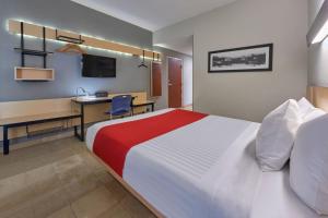 Postel nebo postele na pokoji v ubytování City Express by Marriott Cancun
