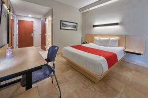 Postel nebo postele na pokoji v ubytování City Express by Marriott Cancun