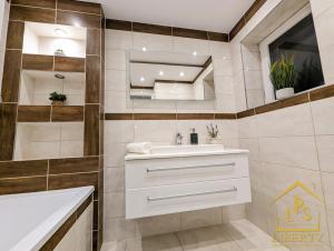 a bathroom with a sink and a mirror at 6 Guests * 4 Bedroom * Free Wi-Fi *Huntingdon in Huntingdon +56 photos