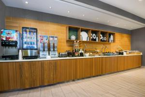 a fast food counter in a restaurant with aperature at SpringHill Suites by Marriott San Antonio SeaWorld®/Lackland in San Antonio