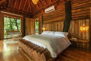 Postel nebo postele na pokoji v ubytování Hotel Boutique Maitta en Doradal Antioquia