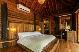 Postel nebo postele na pokoji v ubytování Hotel Boutique Maitta en Doradal Antioquia
