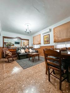 a living room with a couch and a table at Casa Cruz in Almodóvar del Río