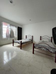 Postel nebo postele na pokoji v ubytování CASA EN FLANDES A 10 MIN DE GIRARDOT