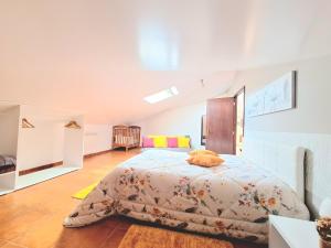 a bedroom with a bed with a cat laying on it at Discovery Apartment in Santana