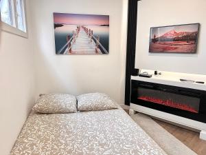 Postel nebo postele na pokoji v ubytování Cocon cosy entre Paris et Disney - Le Camélia