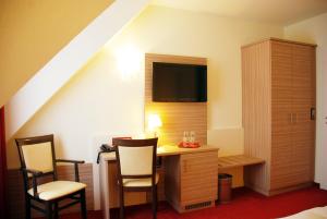 TV a/nebo společenská místnost v ubytování Hotel Mühleneck