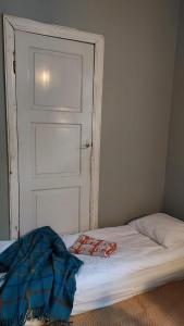 Cama ou camas em um quarto em Entisajan Helmi