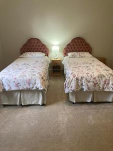 A bed or beds in a room at North Clifton Hall