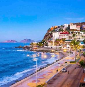a view of the beach in positano on the amalfi coast at Charming Condo in Gaviotas Walk to Beach cafes, restaurants within Golden Zone in Mazatlán