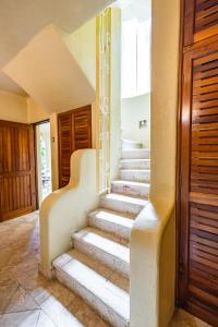 a set of stairs in a house at Villas Xaguar by PlayaSky in Playa del Carmen