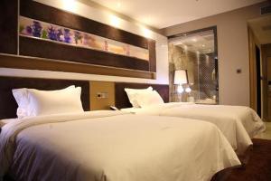 Voodi või voodid majutusasutuse Lavande Hotel Zhanjiang Guomao toas