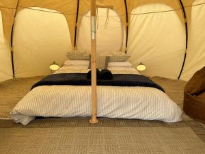 a bed in a tent in a room at Seacroft Estate in Apollo Bay