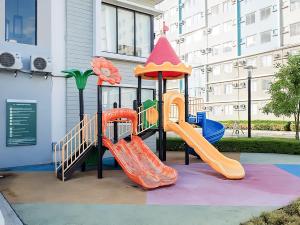 a playground with a slide in a building at Affordable 2 Bed Condo Rental in Davao City with Wifi & Netflix, Swimming Pool, Gym & Billiard Hall in Davao City