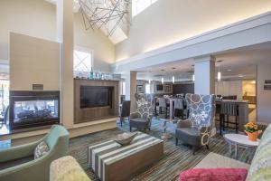 a lobby with chairs and a living room at Residence Inn by Marriott Amelia Island in Fernandina Beach