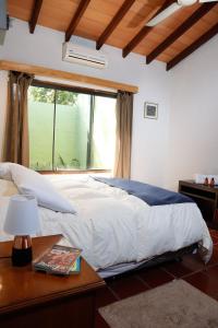 A bed or beds in a room at Villa Adela