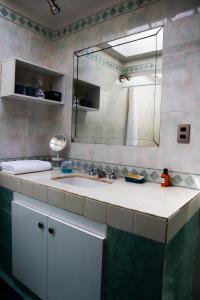 a bathroom with a sink and a mirror at Villa Adela in Luque