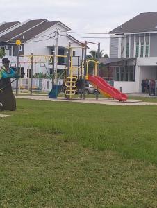 a park with a playground with a slide at Asmar's Homestay Alor Setar in Alor Setar