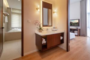 Posteľ alebo postele v izbe v ubytovaní Wuyu Hotel, Smart Park & Happy Valley Jinshansi Metro