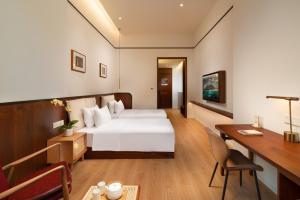 Posteľ alebo postele v izbe v ubytovaní Wuyu Hotel, Smart Park & Happy Valley Jinshansi Metro