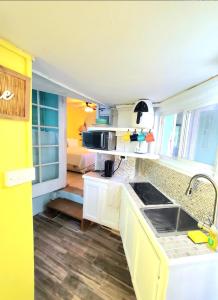 a kitchen with a sink and a counter top at Beachfront Cozy Apt in Gros Islet