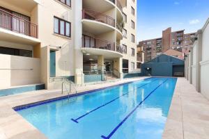 a swimming pool in the middle of a building at Entire Apartment in Surry Hills in Sydney