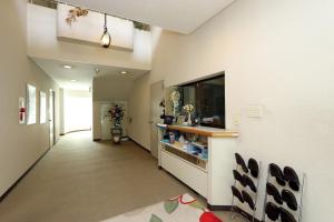 a hallway of a hospital with a counter and a room at Teiensaryo Yamanakako in Yamanakako +23 photos