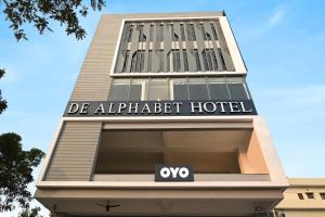 a building with a hotel sign on top of it at Townhouse De Alphabet Karmanghat in Hyderabad
