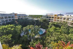 an aerial view of a city with trees and buildings at Luxury Jungle Loft, 7 Pools, Rooftop Panoramic View, Beach Shuttle, Fast WiFi in Tulum