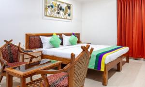 Katil atau katil-katil dalam bilik di Treebo Y Hotels Elite, Khandagiri