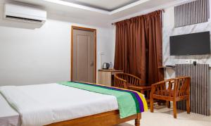 Katil atau katil-katil dalam bilik di Treebo Y Hotels Elite, Khandagiri